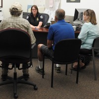 CBP Officer processing trusted traveler applicants